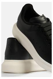 Alexander McQueen Oversized in black with a white sole